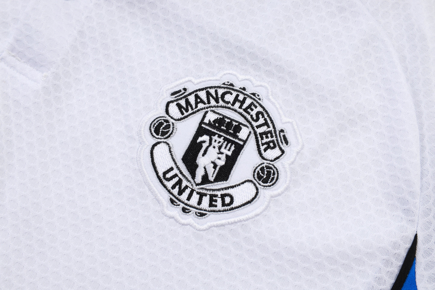 Manchester U. bianco 2026 Training Set – Polo + Pants Slim Fit